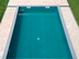 Piscine et plage de piscine en dalles de travertin Medium Line vues de haut