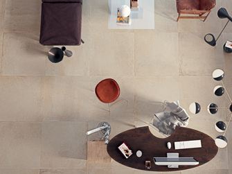 Une salle à manger en carrelage effet béton Pure Sand