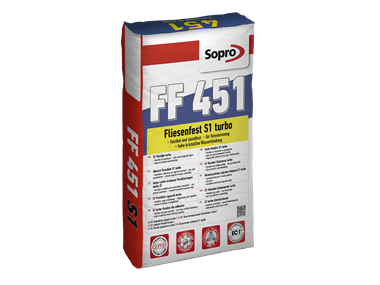 Un sac mortier-colle flexible gris à prise rapide