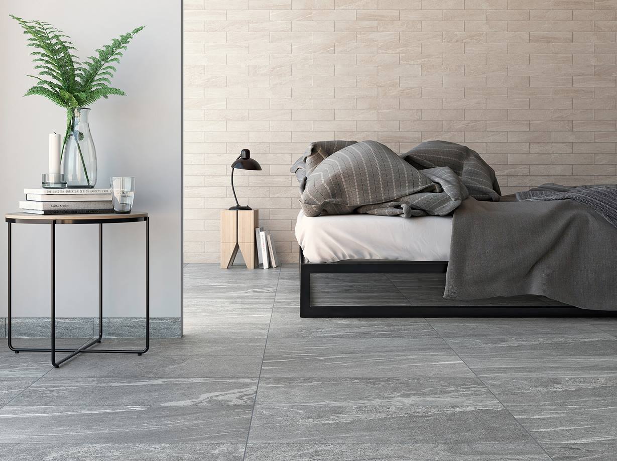 Une chambre moderne au carrelage effet granite Le choix du carrelage joue un rôle important dans le style d'une chambre. Ici, l'accent a été mis sur la modernité.